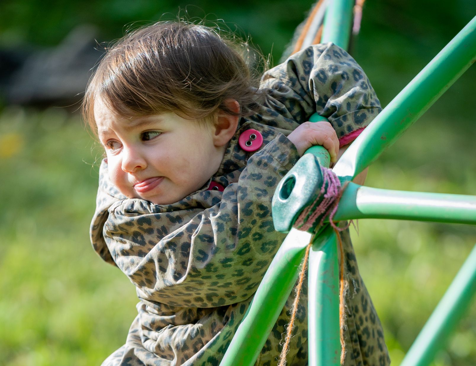 child playing on climbing frame