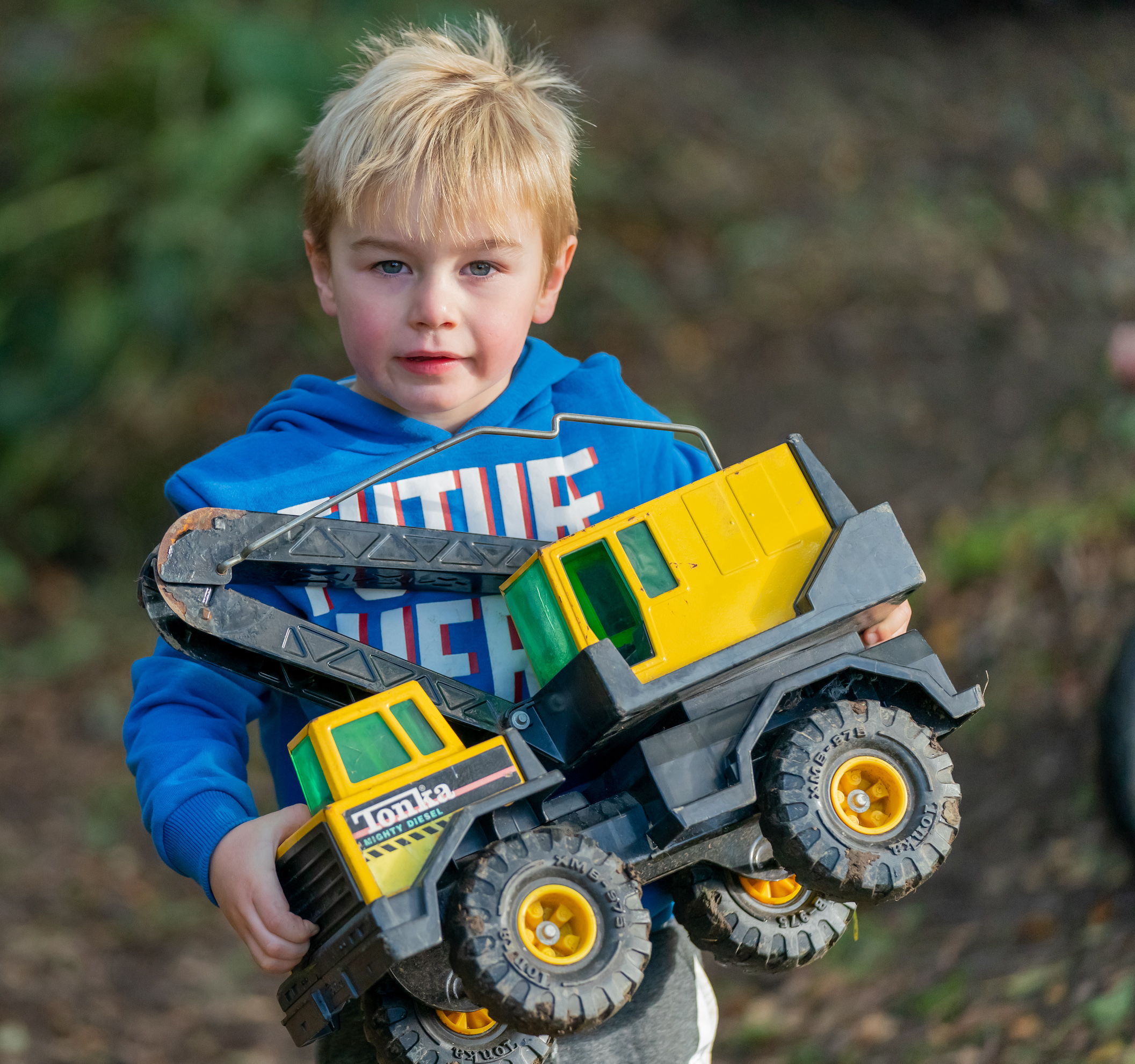child playing with toy digger