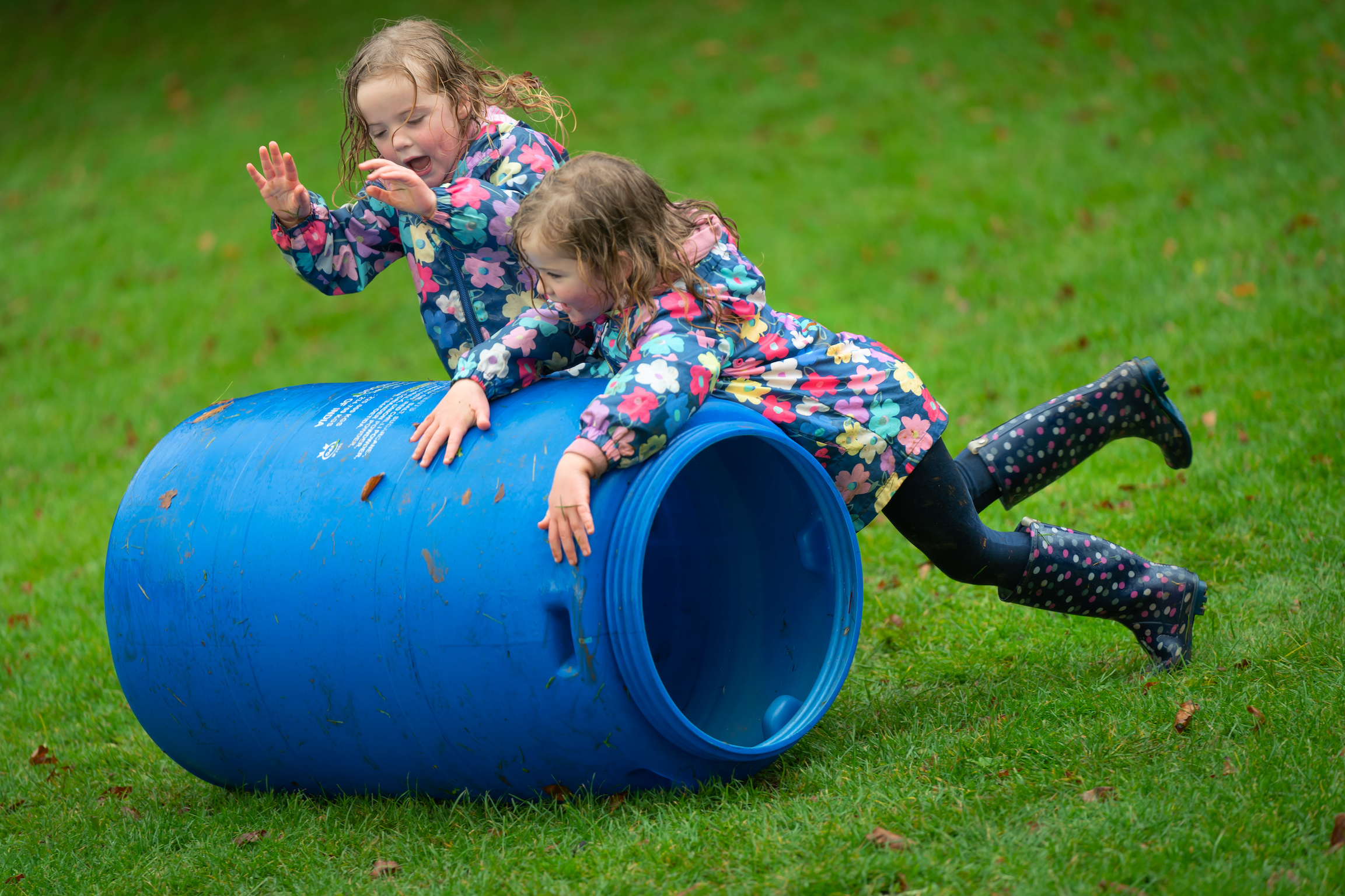 children playing with empty barrel